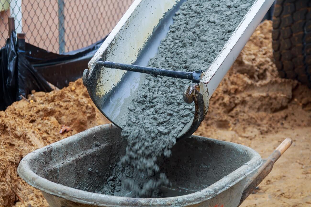 wheelbarrow pouring mortar into the foundations of 2025 03 27 04 58 07 utc